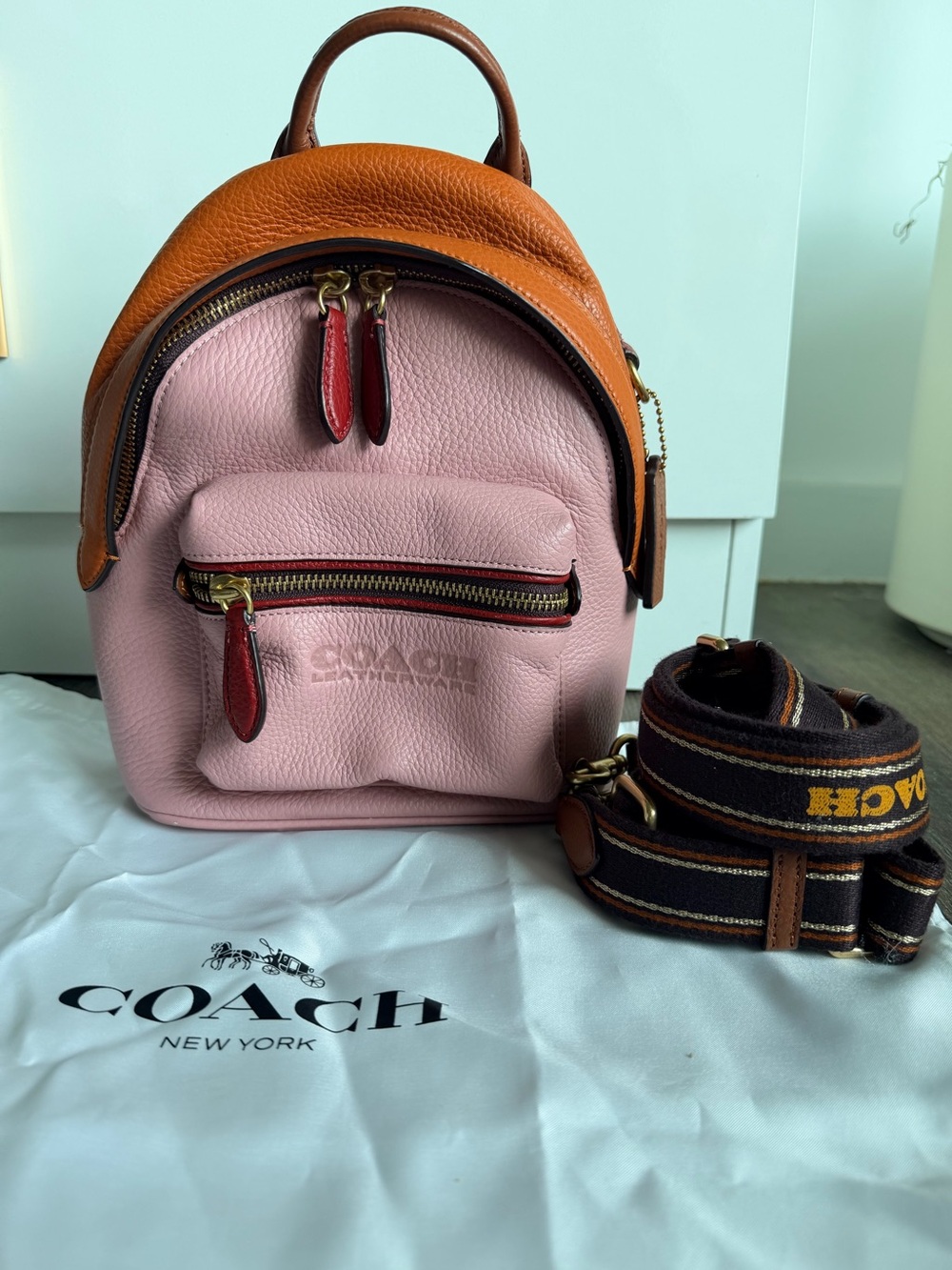 Coach Pink Pebbled Leather Mini Backpack with Saddle Brown Trim